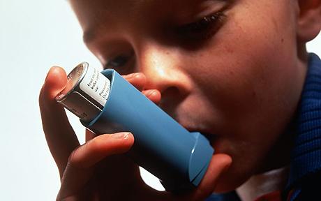 Kid using an inhaler 
