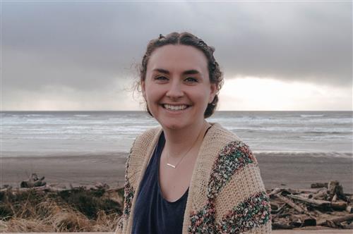 Miss Sweeney smiling at the beach