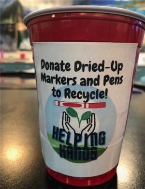 Students designed a cup with logo to place in each classroom for used markers and pens.