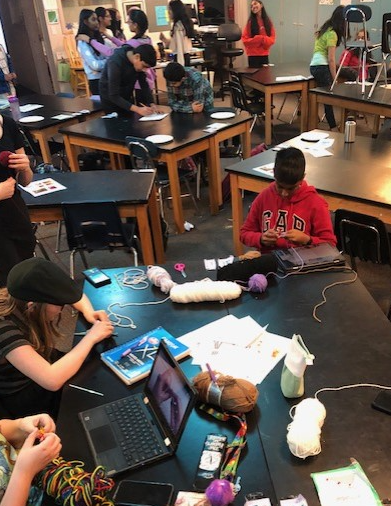 Students working and planning during club